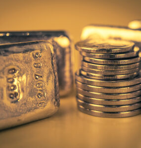 Gold Bars And Stack Of Gold Coins